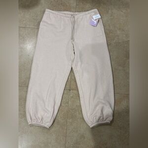 Cream Track Pants with Elastic Cuffs and Relaxed Fit
